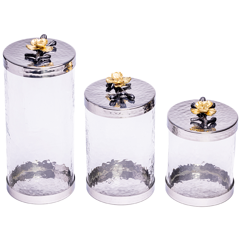 3 canisters with gold and black flower handle