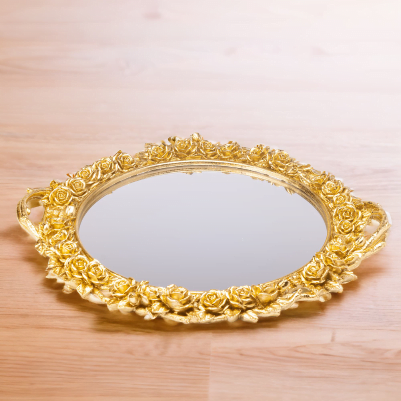 An ornate Flower Tray on a wooden table.