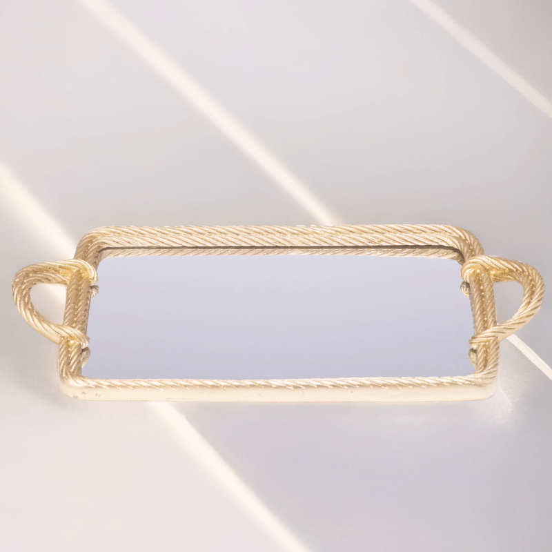 A Twisted Tray with a mirror on it.
