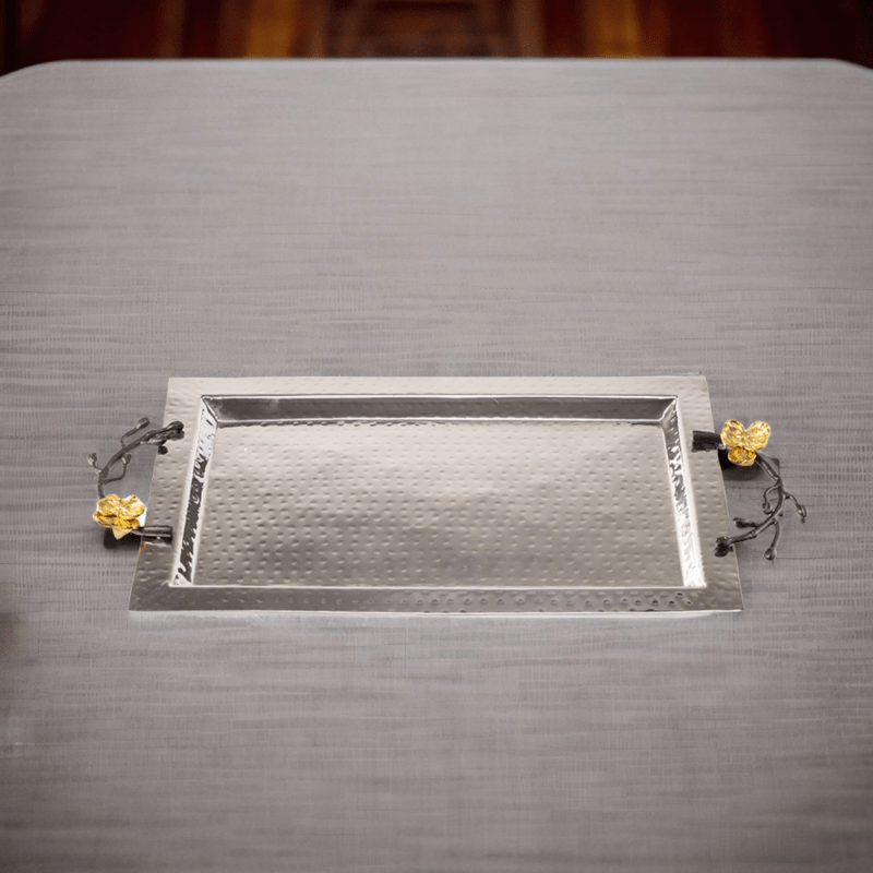 A Souha Tray on a table with flowers on it.