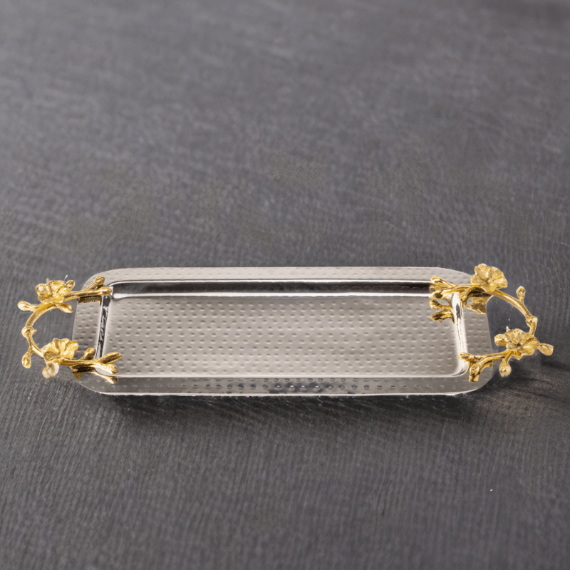 A Long Floral Tray with gold and silver accents.