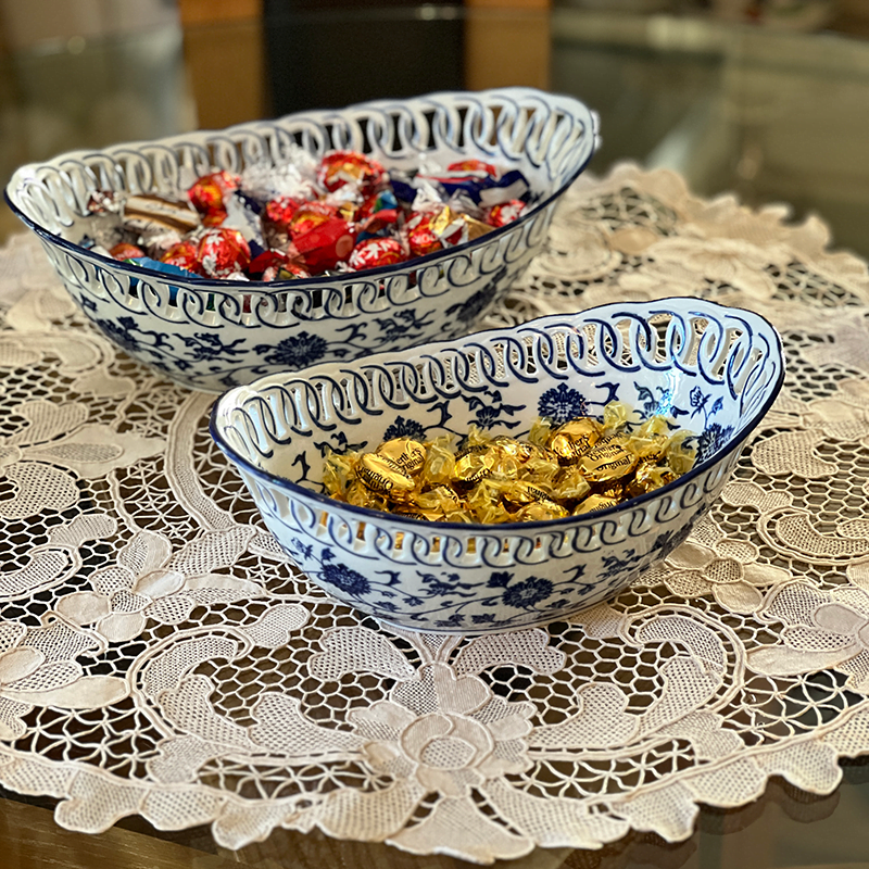 2 fine china bowls filled with sweets