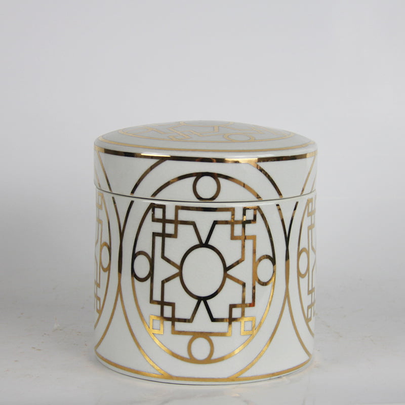 large ceramic canister with gold accents