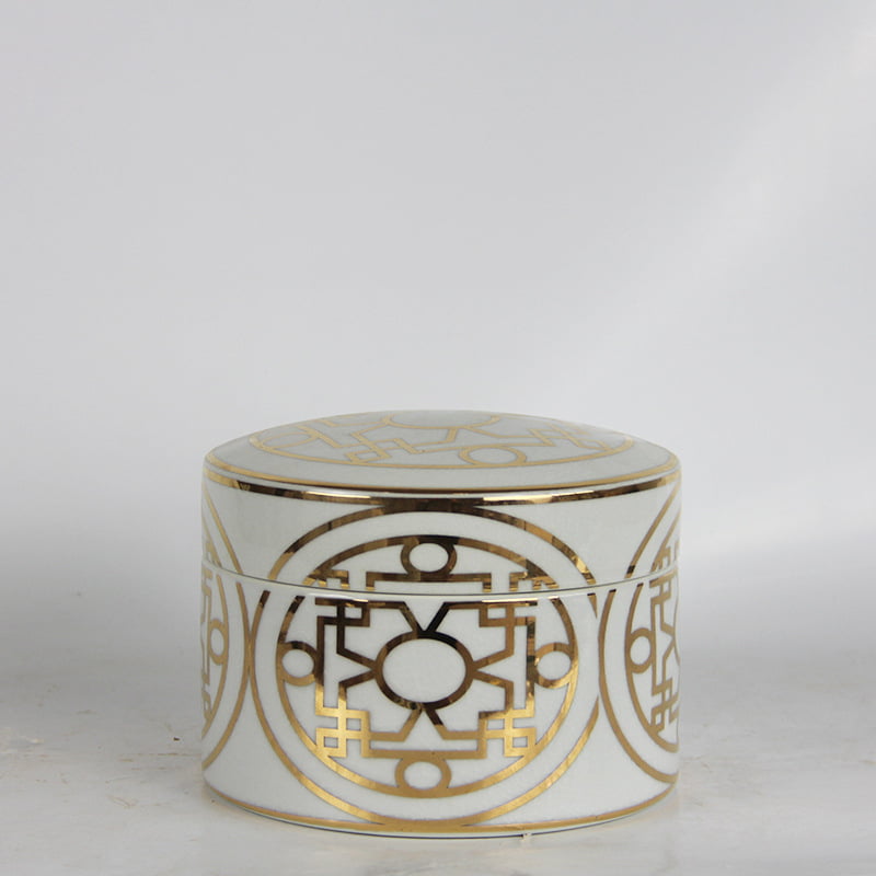 medium ceramic canister with gold accents