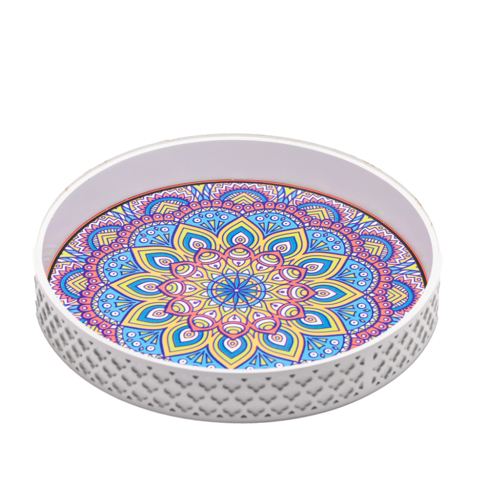 a white decorative tray styled with vibrant patterns.