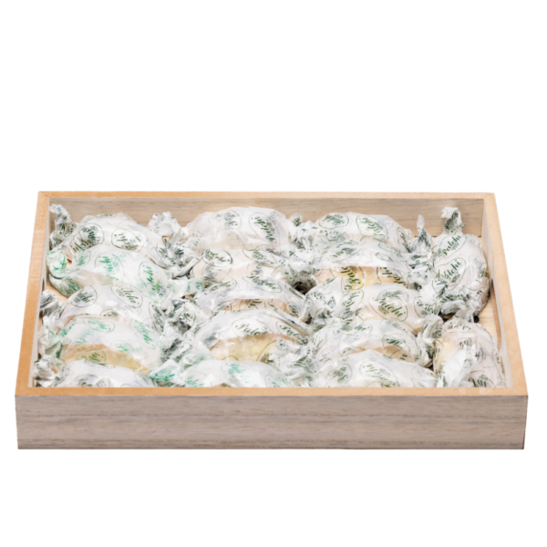 wood serving tray filled with arabic sweets.