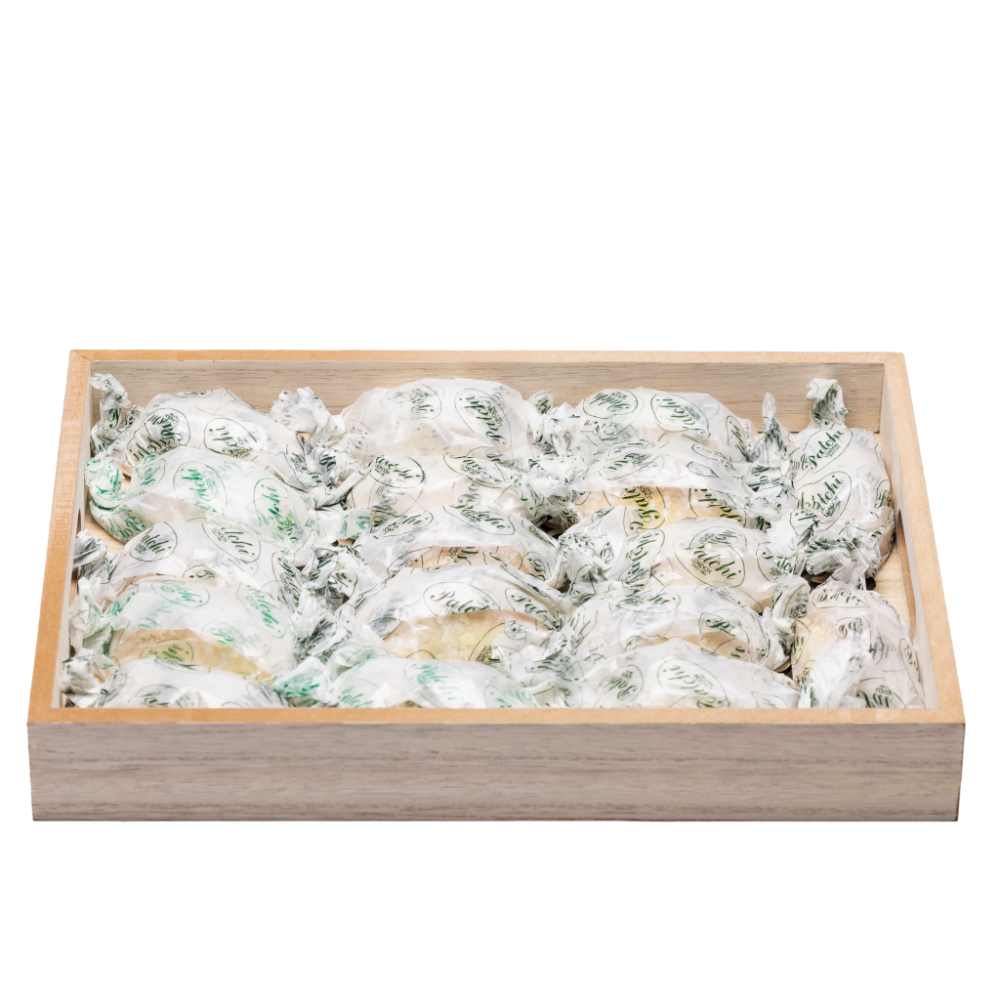 wood serving tray filled with arabic sweets.
