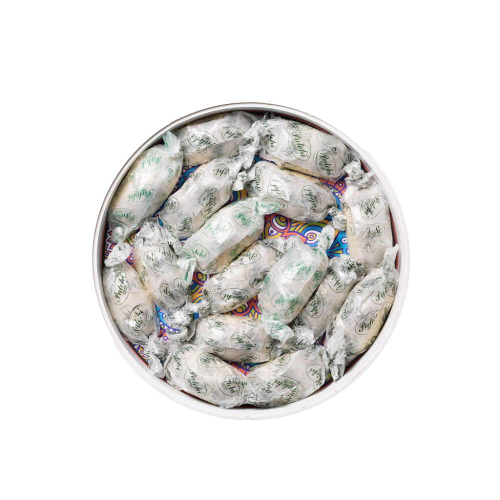 a white decorative tray filled with ramadan sweets.